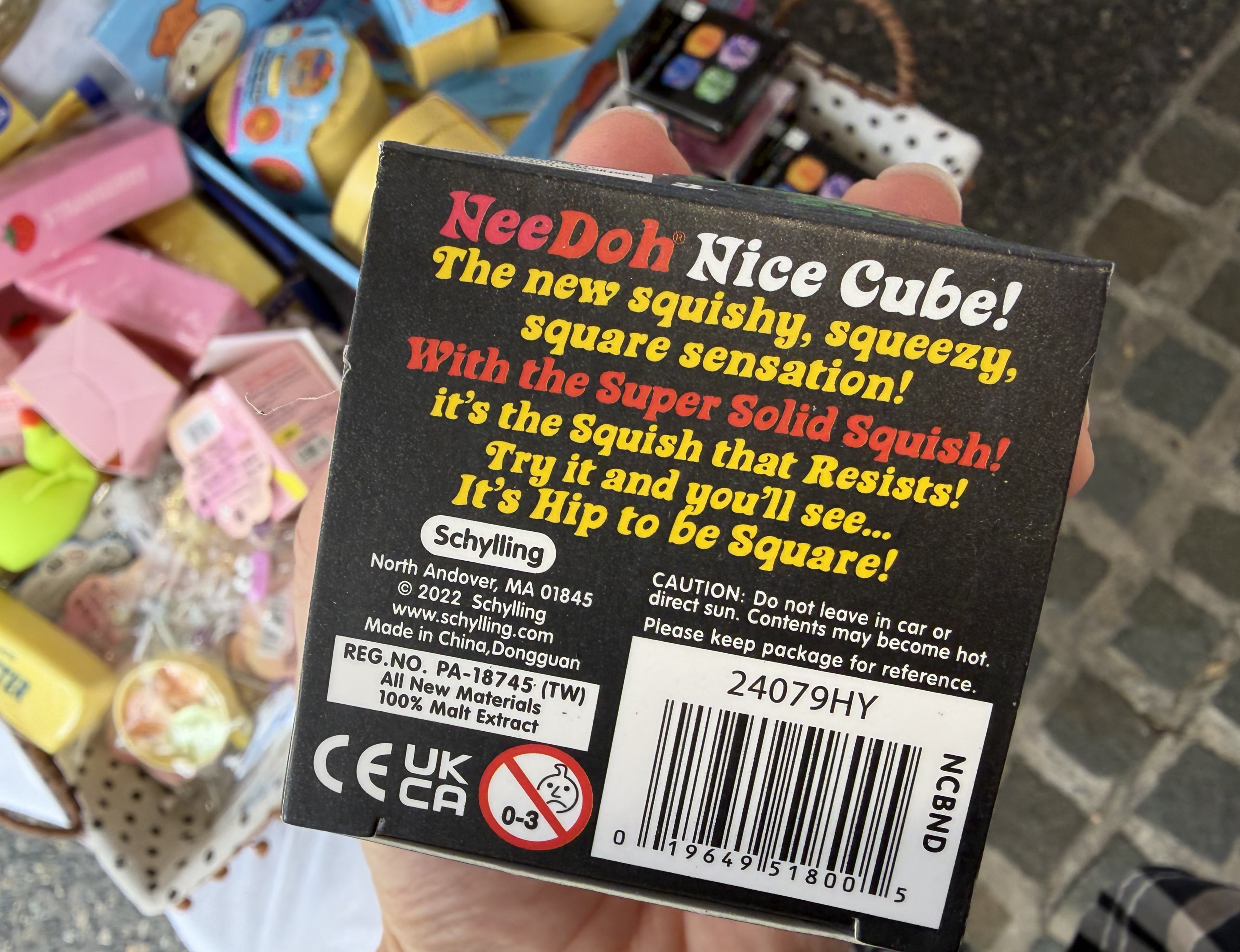 The back of a NeeDoh Nice Cube box showing ingredients listed as 100% malt extract.