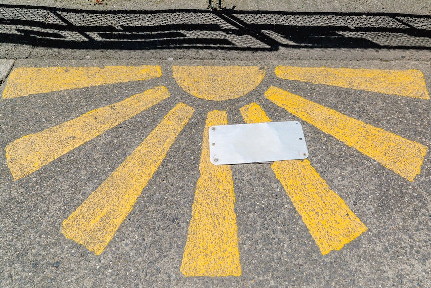 A half sun painted on a footpath