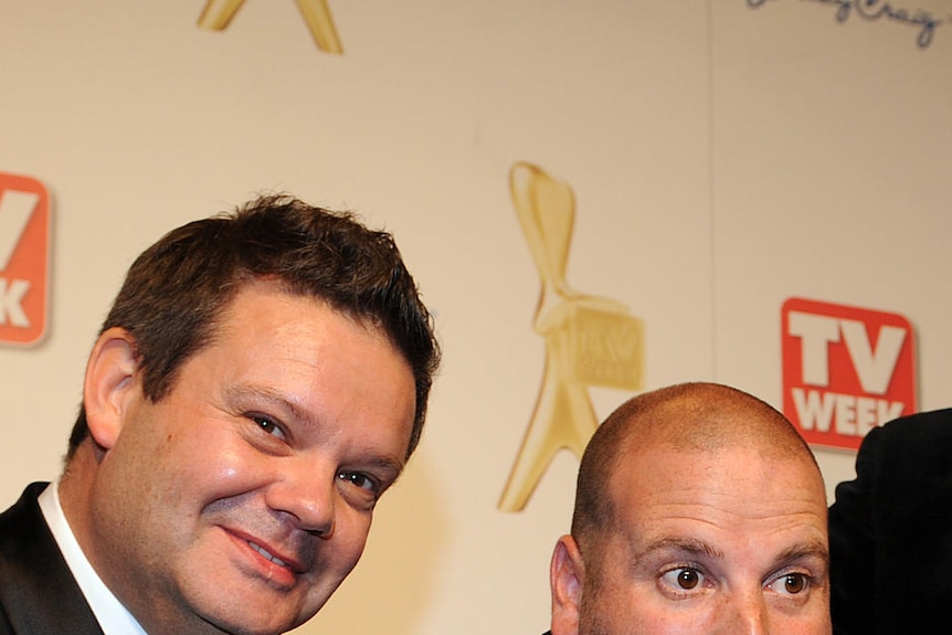 Gary Mehigan, George Calombaris and Matt Preston smile while holding a silver Logie.