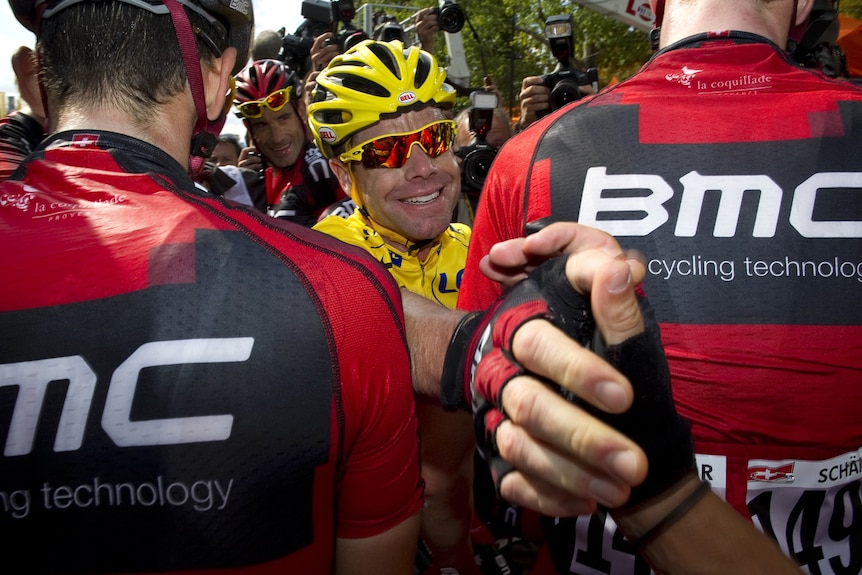 Australian overall leader Cadel Evans (C) celebrates with BMC team-mates on the Champs Elysees.