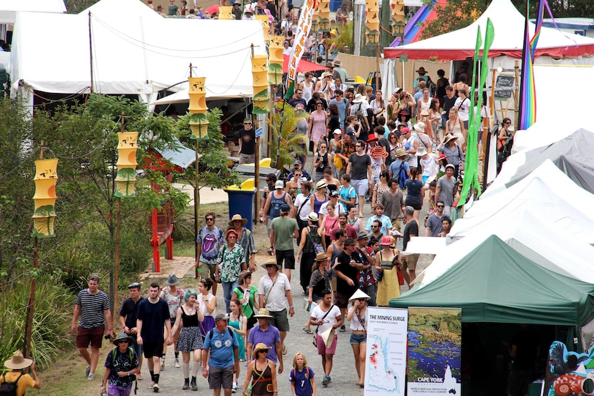 The crowd make their way through some of the stalls at the Woodford Folk Festival.