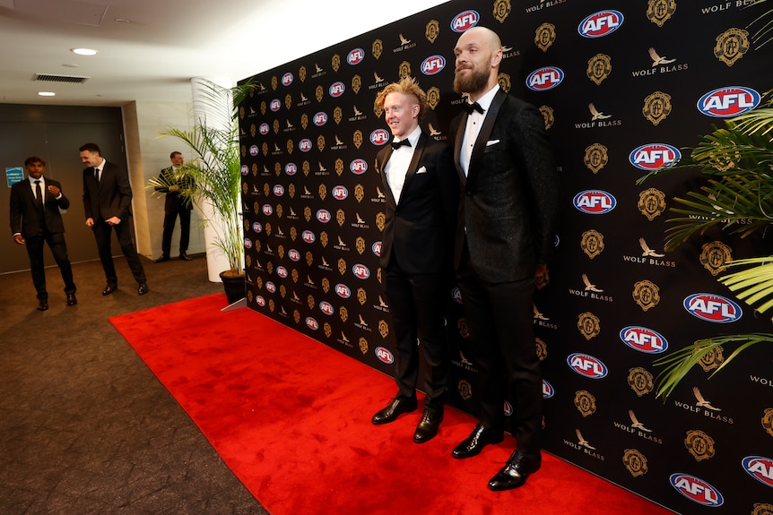 Two Melbourne Demons players pose in their tuxedos ahead of the Brownlow Medal ceremony in Perth. 