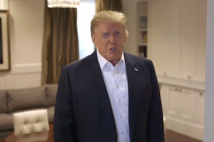 US President Donald Trump wearing black jacket and white collared shirt