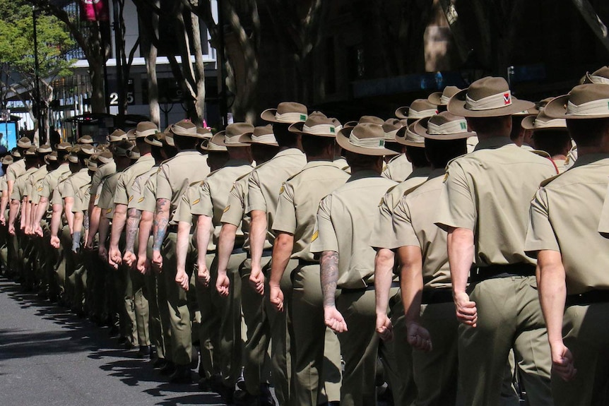 Soldiers marching up Adelaide Street, seen from behind