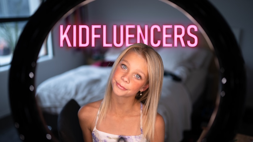 A girl with blonde hair looks in a mirror which is actually the camera, with the words 'Kidfluencers' written above in neon pink