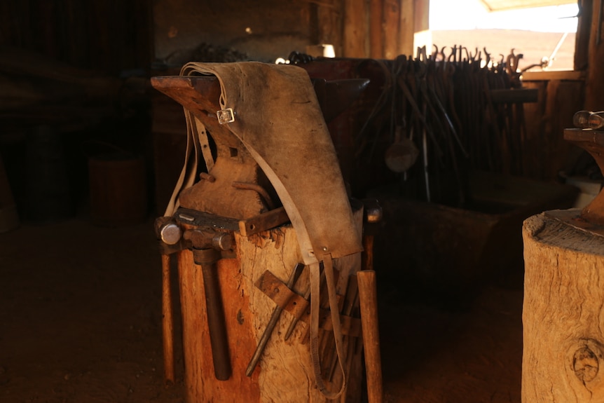 Blacksmithing equipment in an old forge.