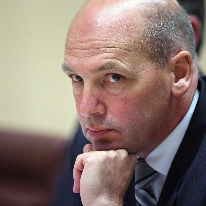 Stephen Parry rests his chin on his fist looking pensive