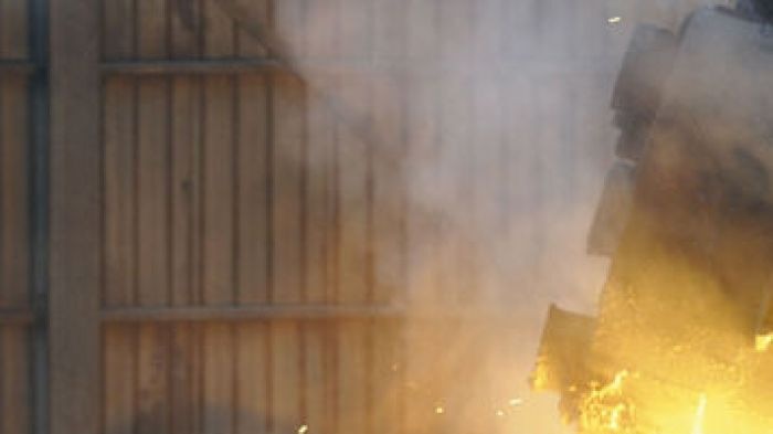 A labourer walks at a steel and iron factory in Changzhi, Shanxi province