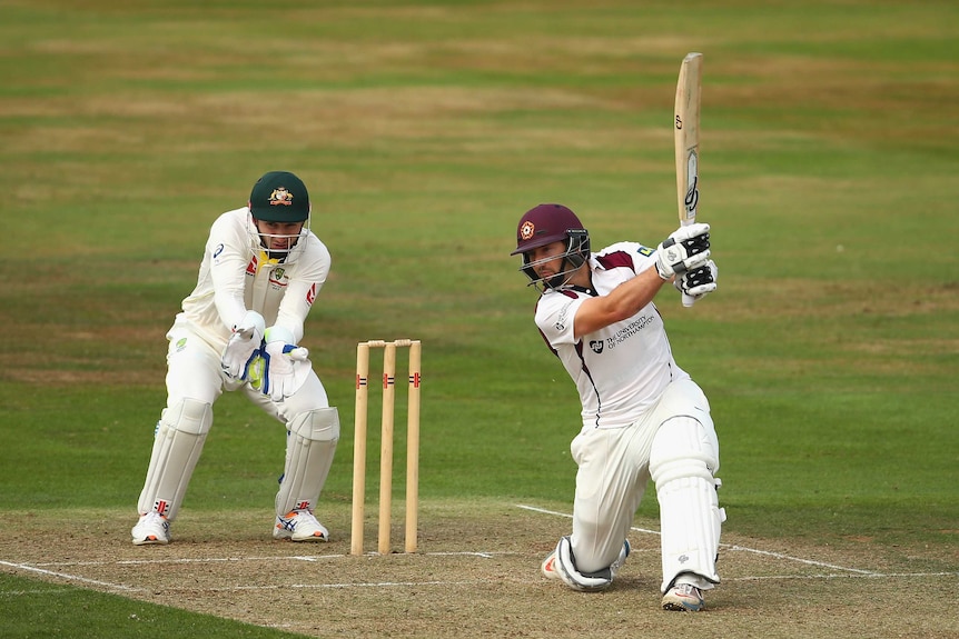 Steve Crook drives to the boundary