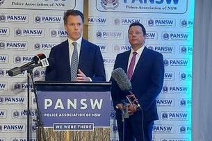 Labor leader Chris Minns and Wollongong MP Paul Scully address the media at the NSW Police Association conference