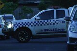 A police vehicle outside a house.