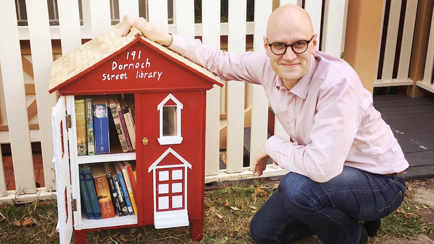 A street library filled with books in Highgate Hill.