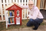 A street library filled with books in Highgate Hill.