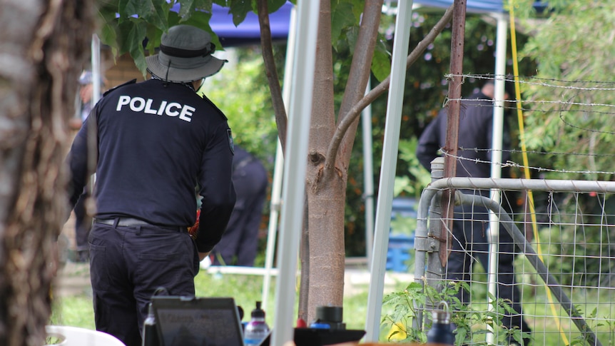 Police search a backyard in North Mackay. 