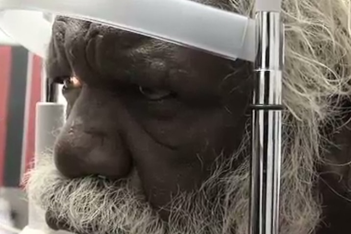 An Aboriginal man's eyes are checked in Central Australia