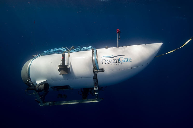 A photo of a white submersible under water.