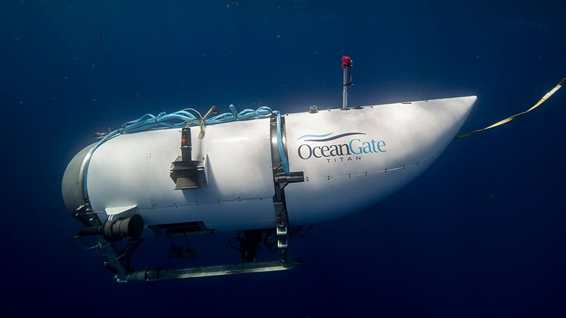 A photo of a white submersible under water.