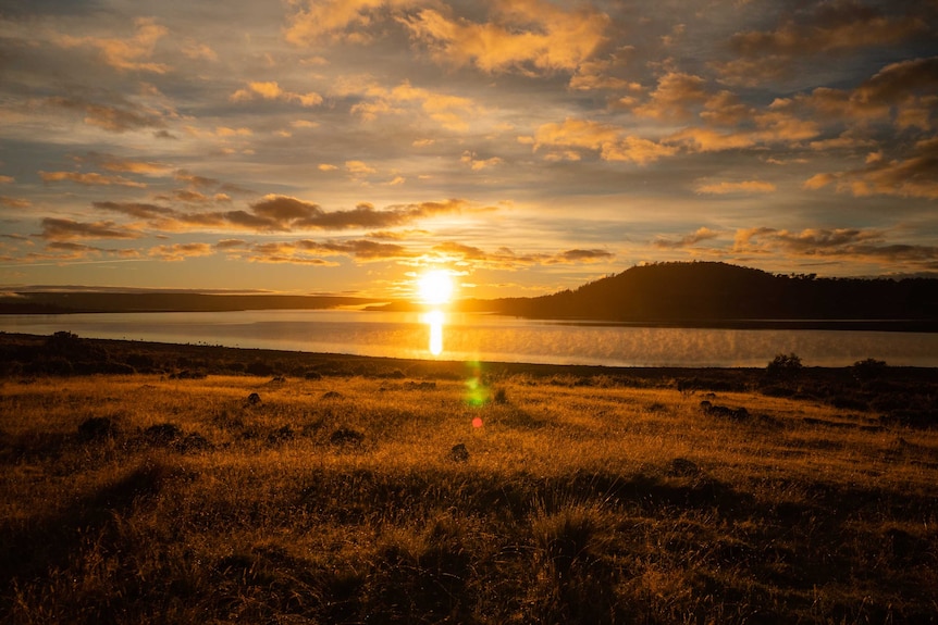 The sun rises over Great Lake in Tasmania's Central Highlands