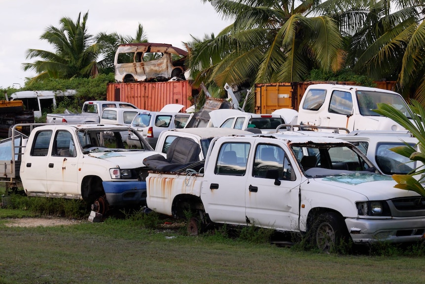 Old rusting car bodies stockpiled at the West Island recycling centre.