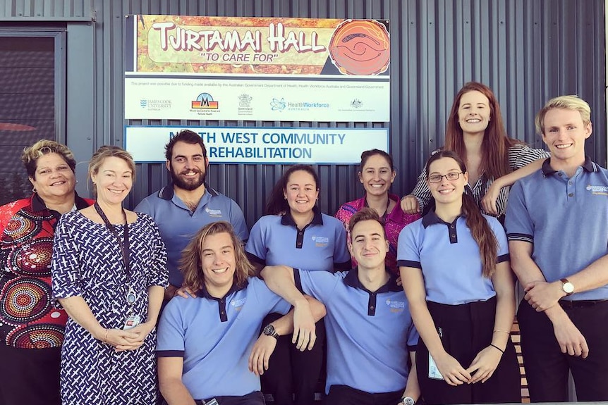 Group of young people wearing blue shirts