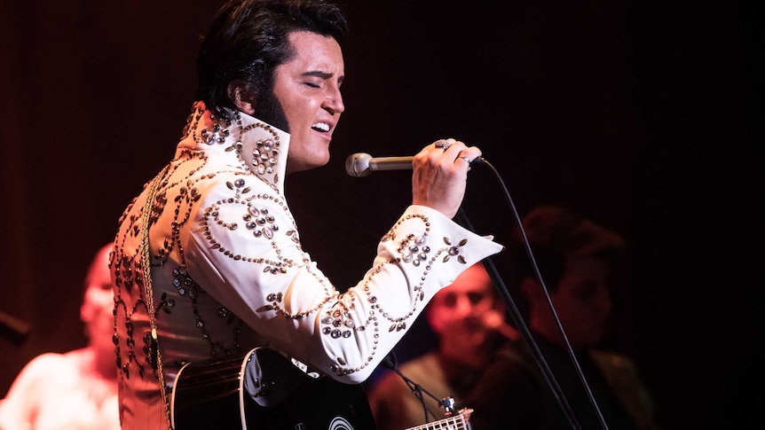 Elvis Presley tribute artist Ben Portsmouth performing on stage in Las Vegas