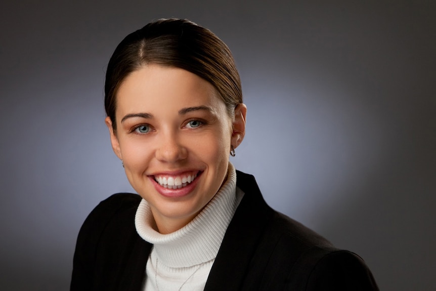 A woman smiling at the camera