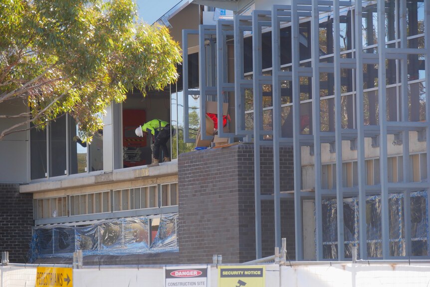Construction workers busy at the Broken Hill Police Station, July 2022. 