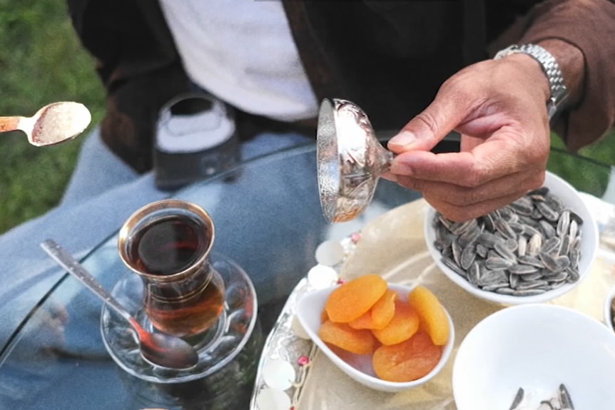 A photo of Turkish Kurdish tea and apricots and sunflower seeds