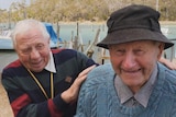 Two elderly men, japing on the river shore