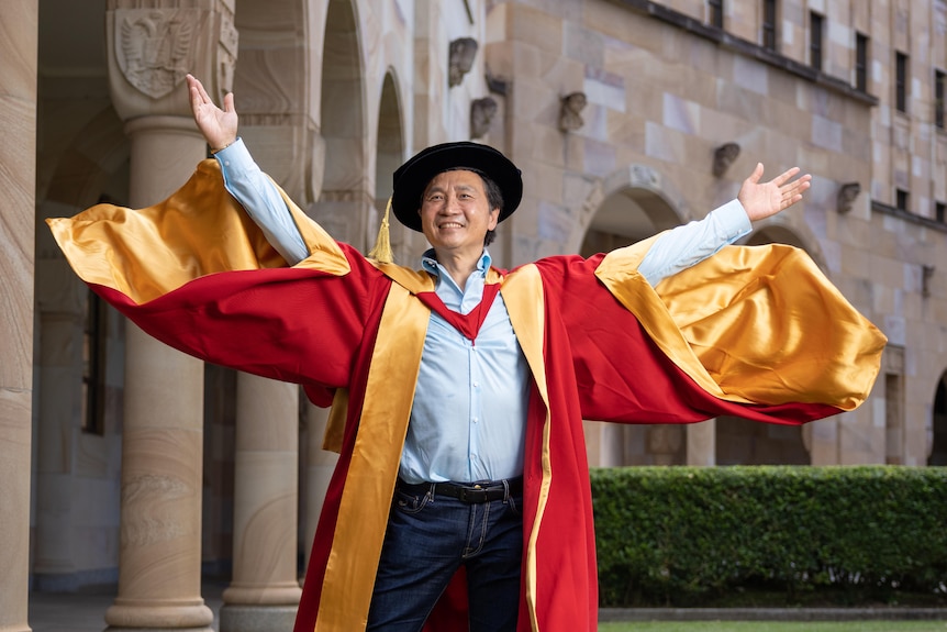 A chinese man at a graduation ceremony