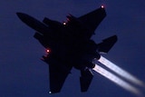 US F-15 flying at night