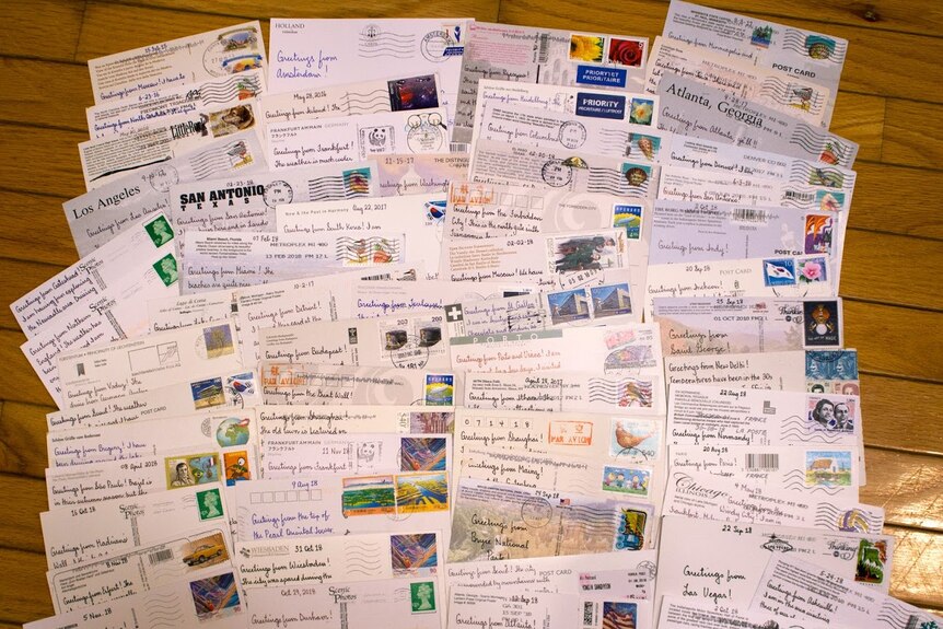 The backs of Paul Whelan's postcards, with messages from his travel destinations.