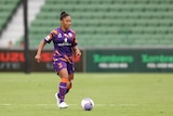 Perth Glory A-League Women player Jessika Cowart prepares to kick the ball during a game.