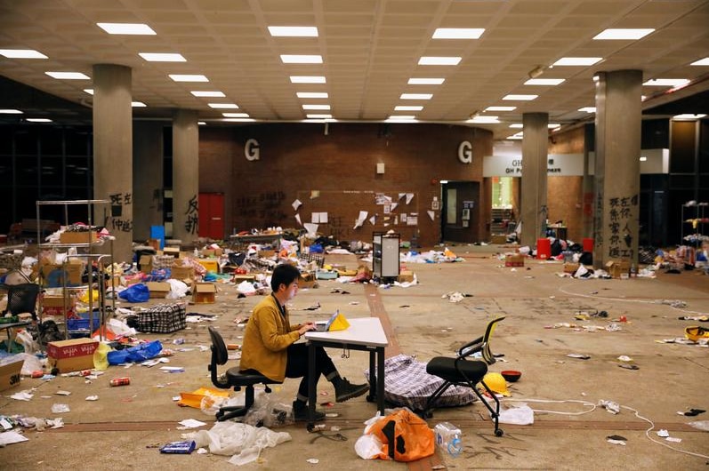 Journalist working among hte mess  in university after the siege.