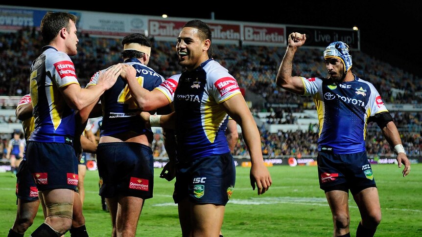 Cowboys winger Antonio Winterstein celebrates Gavin Cooper's try against Cronulla in June 2013.