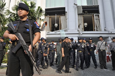 Indonesian counter-terrorist police commandos secure the damaged Ritz-Carlton hotel in Jakarta