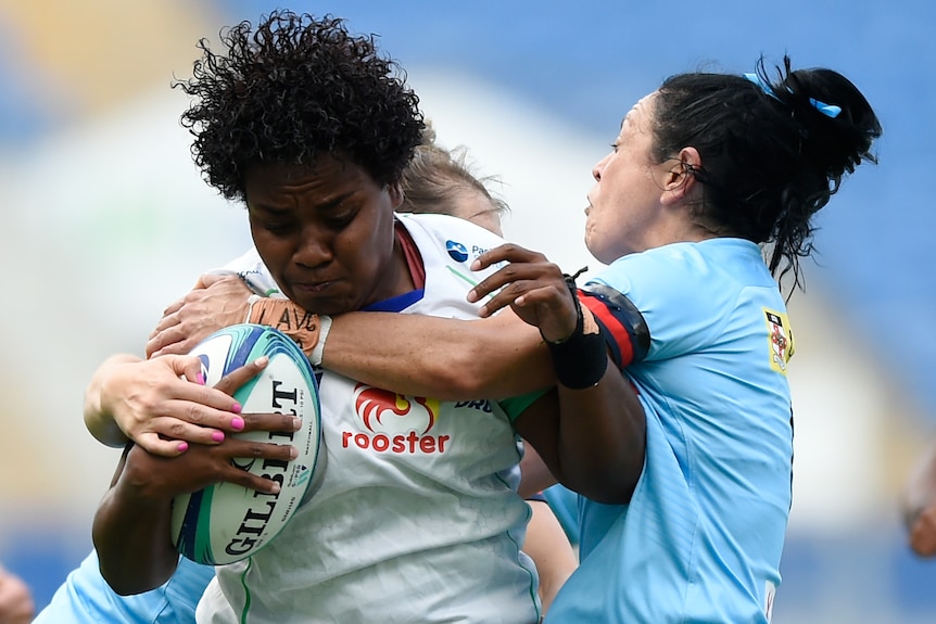 Fijiana Drua player is tackled by a Waratahs player during the round five Super W match. 