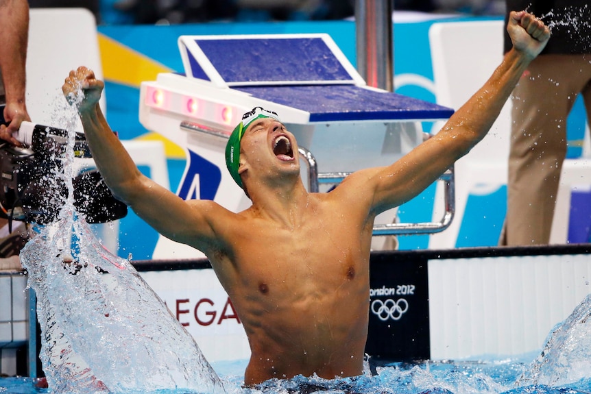 Chad le Clos of South Africa leaps out of the water after winning the men's 200m butterfly final.