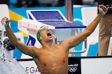 Chad le Clos of South Africa leaps out of the water after winning the men's 200m butterfly final.