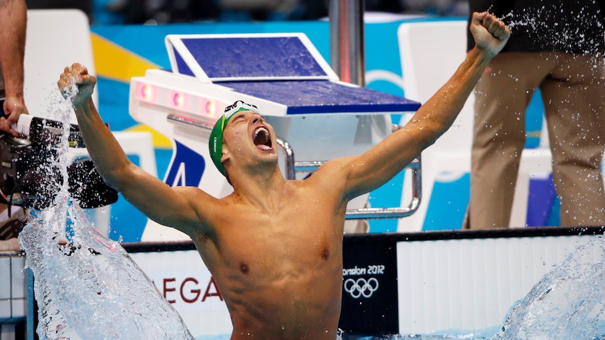 Chad le Clos of South Africa leaps out of the water after winning the men's 200m butterfly final.