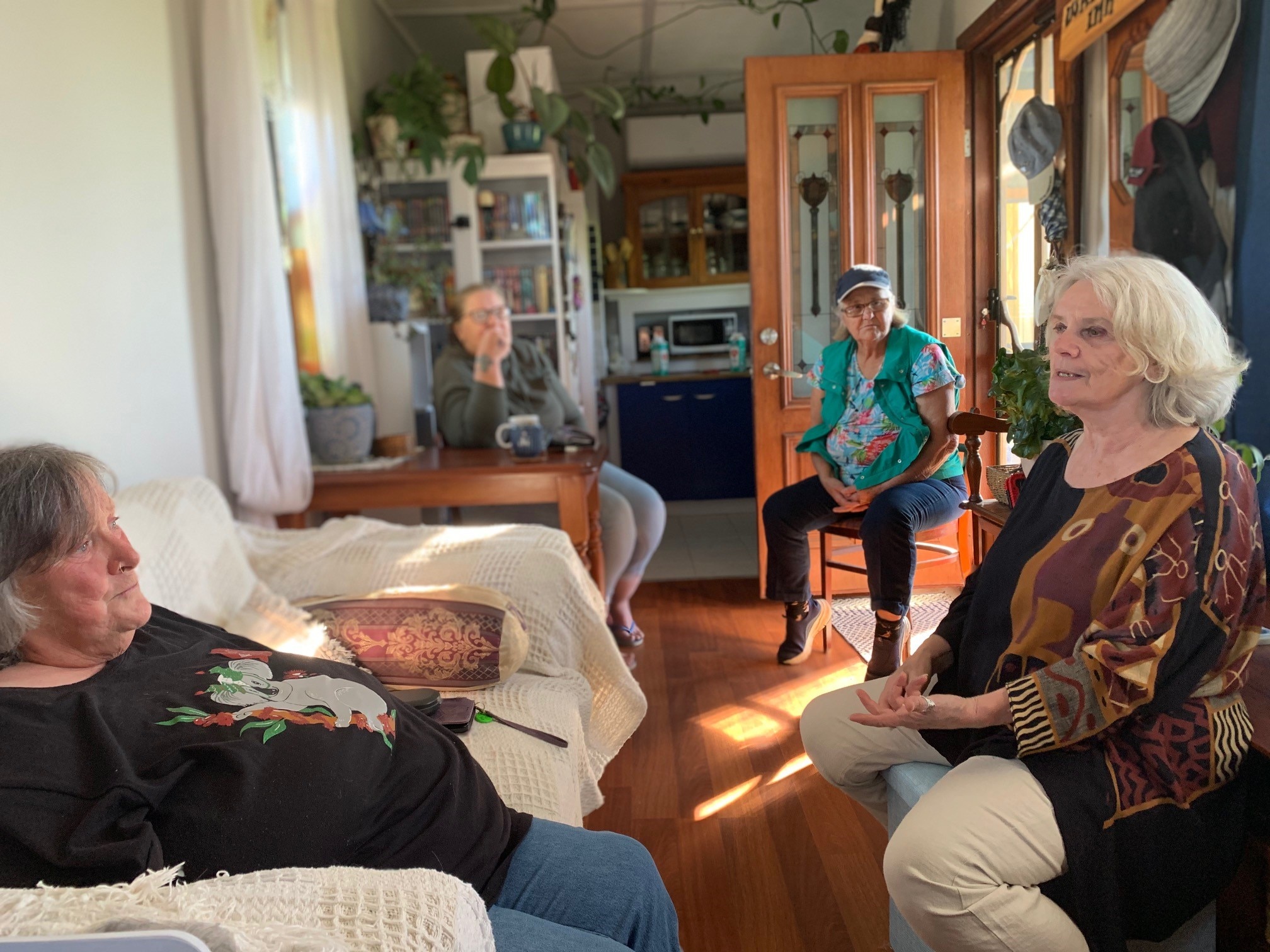 women talking in a lounge room