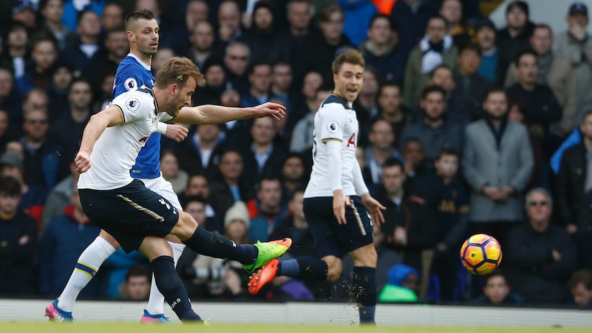 Harry Kane (nearest camera) shoots and scores for Spurs against Everton at White Hart Lane.