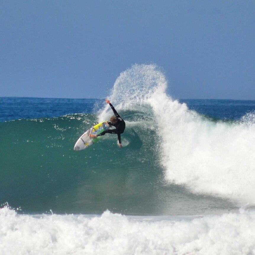 A surfer at Bells Beach