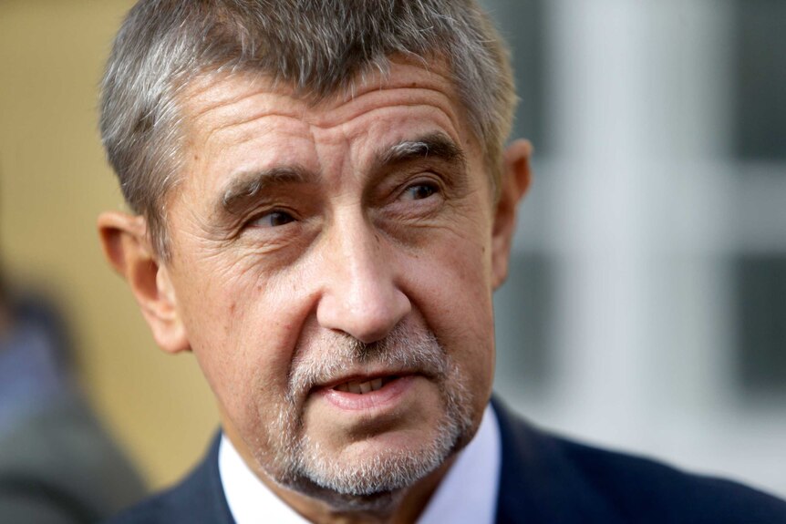 Close-up shot of Andrej Babis looking to the side of the camera.