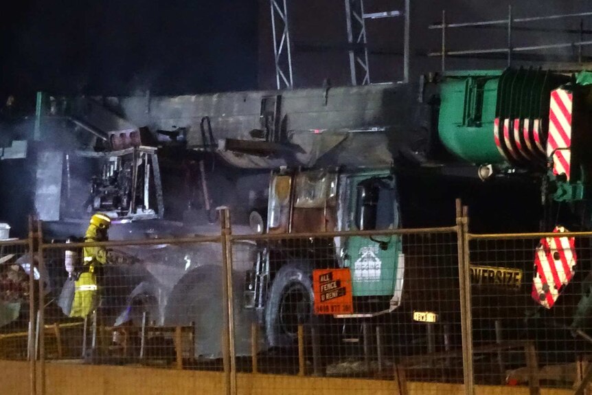 A crane destroyed in a suspected arson attack in Perth suburb of Gnangara.