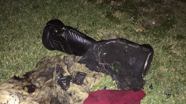 Photo of hoverboard on front lawn of a house after it exploded while being charged.