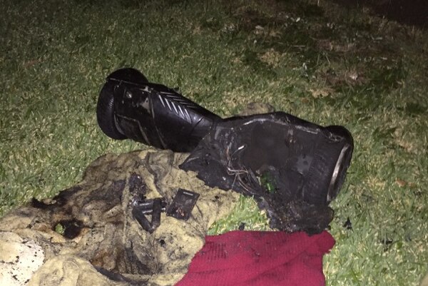 Photo of hoverboard on front lawn of a house after it exploded