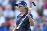 A South African golfer celebrates winning the women's Australian Open.