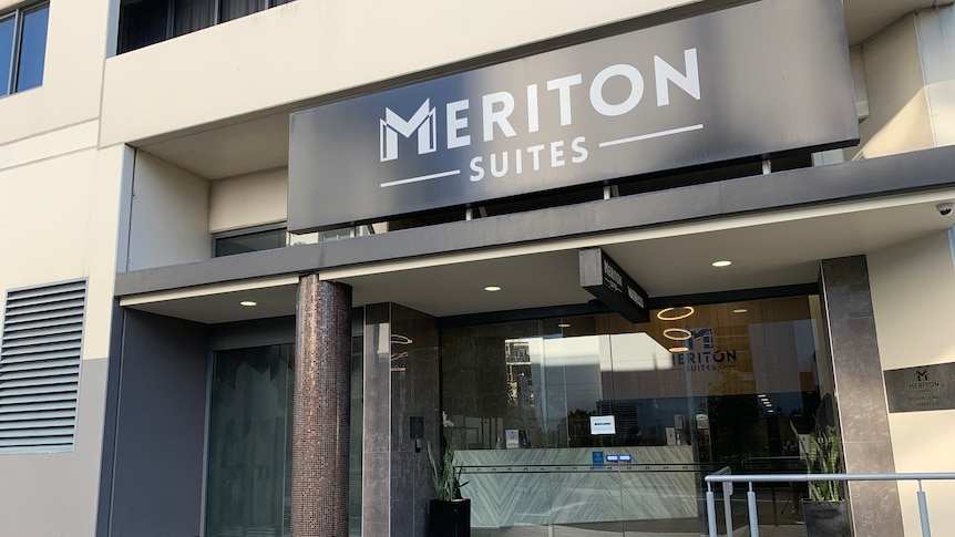 A doorway with the words Meriton Suites written at the top.
