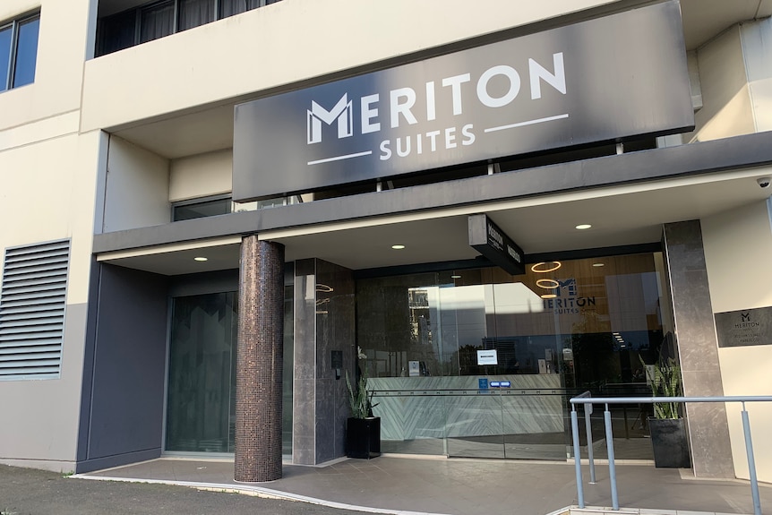 A doorway with the words Meriton Suites written at the top.